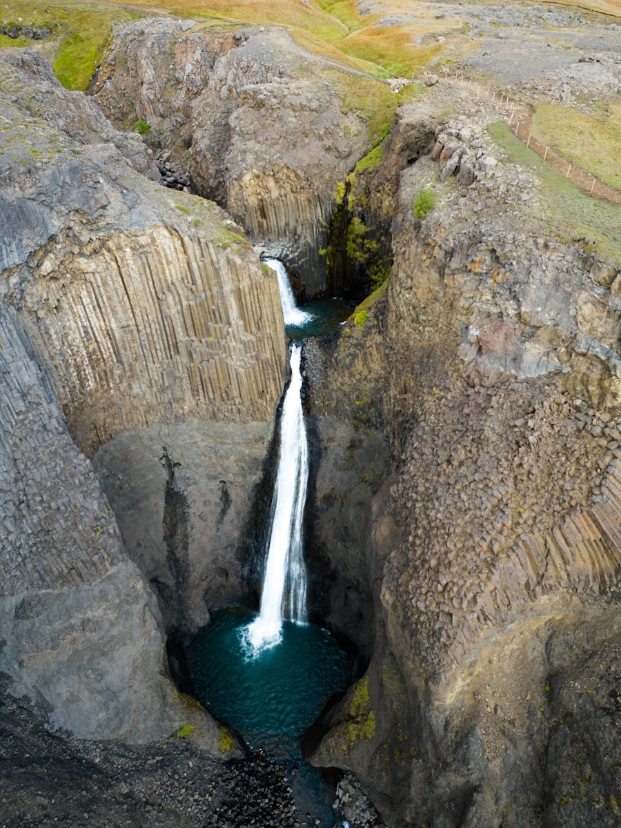 A small waterfall is coming out of the rocks