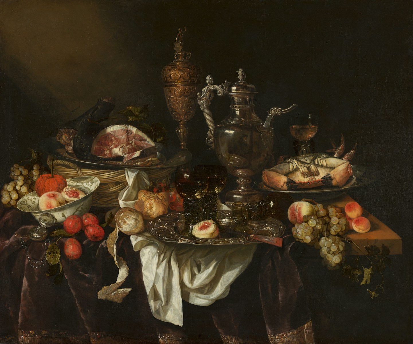 A still life of food and ornate silver objects
